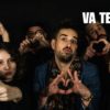 Le chanteur Lozange entouré de plusieurs personnes formant des cœurs avec les mains, dans une ambiance festive issue du clip "Va te faire".
